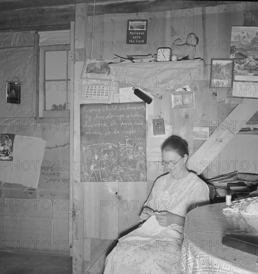 Mrs. Hull in one-room dugout basement home, Dead Ox Flat, Malheur County, Oregon, 1939. Creator: Dorothea Lange.