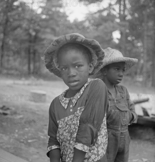 Possibly: Grandchildren of tobacco sharecropper down at barns, Wake County, North Carolina, 1939. Creator: Dorothea Lange.