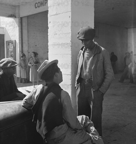 Outside the FSA grant office during the pea harvest, Calipatria, California  1939. Creator: Dorothea Lange.