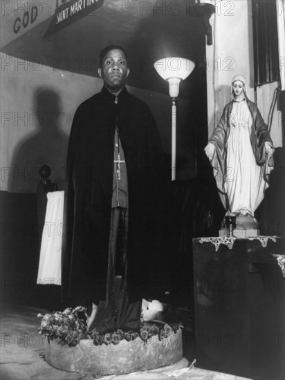 Reverend Vondell Gassaway, pastor of the St. Martin's Spiritual Church..., Washington, D.C., 1942. Creator: Gordon Parks.