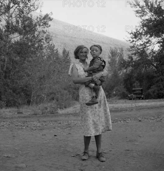 Champion hop picker in squatter camp before the season opens, Washington, Yakima Valley, 1939. Creator: Dorothea Lange.