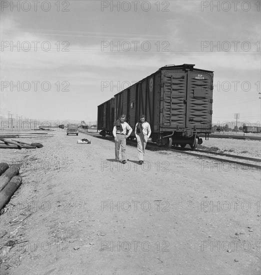 Car on siding across tracks from pea packing plant, Calipatria, Imperial Valley, 1939. Creator: Dorothea Lange.