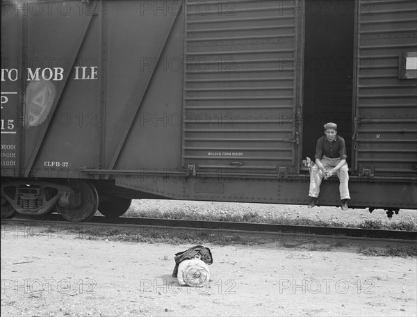 Car on siding across tracks from pea packing plant, Calipatria, Imperial Valley, 1939. Creator: Dorothea Lange.