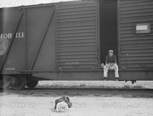 Car on siding across tracks from pea packing plant, Calipatria, Imperial Valley, 1939. Creator: Dorothea Lange.