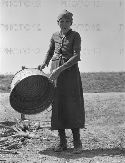 A grandmother in a contractor's camp, Stanislaus County, California, 1939. Creator: Dorothea Lange.