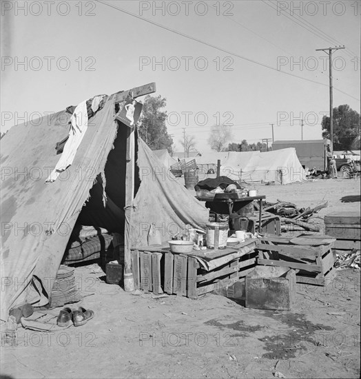 Migratory labor housing during carrot harvest, near Holtville, Imperial Valley, California, 1939. Creator: Dorothea Lange.