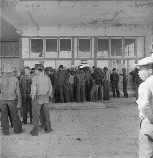 Outside FSA grant office during the pea harvest, Calipatria, California, 1939. Creator: Dorothea Lange.