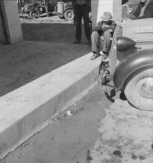 Outside FSA grant office during the pea harvest, Calipatria, California, 1939. Creator: Dorothea Lange.