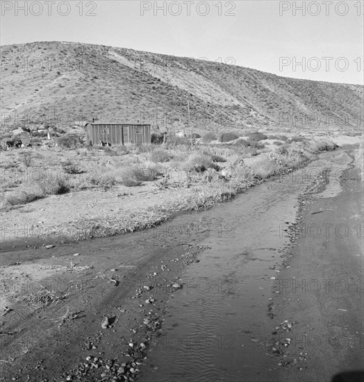 Below the bench, showing condition of road which..., Dead Ox Flat, Malheur County, Oregon, 1939. Creator: Dorothea Lange.