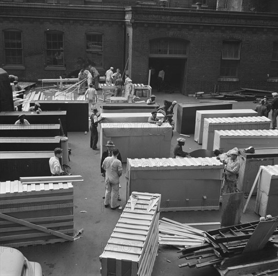 Possibly: United States government workers and carpenters making crates..., Washington, D.C., 1942. Creator: Gordon Parks.