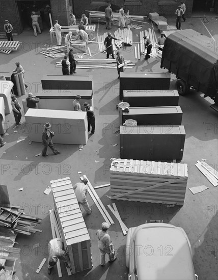 Possibly: United States government workers and carpenters making crates..., Washington, D.C., 1942. Creator: Gordon Parks.