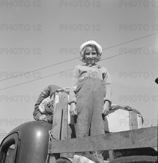 Part of family come for work in potatoes, Tulelake, Siskiyou County, California, 1939. Creator: Dorothea Lange.