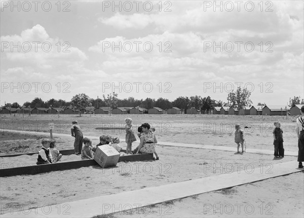 Nursery school children with their teacher, FSA camp, Tulare County, California, 1939. Creator: Dorothea Lange.