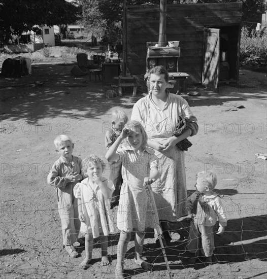 Family living in shacktown community, mostly from Kansas and..., Washington, Yakima Valley, 1939. Creator: Dorothea Lange.