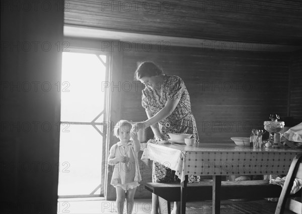 Wife and child of tobacco sharecropper, Person County, North Carolina, 1939. Creator: Dorothea Lange.