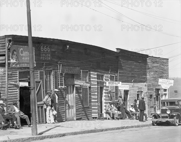 Vicksburg Negroes and shop front, Mississippi, 1936. Creator: Walker Evans.