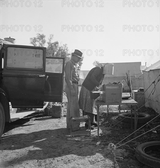 In a carrot pullers' camp near Holtville, Imperial Valley, California, 1939. Creator: Dorothea Lange.