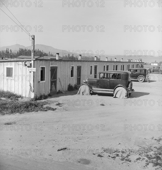 Ten cabins which rent for ten dollars..., Arkansawyers...camp, Greenfield, Salinas Valley, CA, 1939. Creator: Dorothea Lange.
