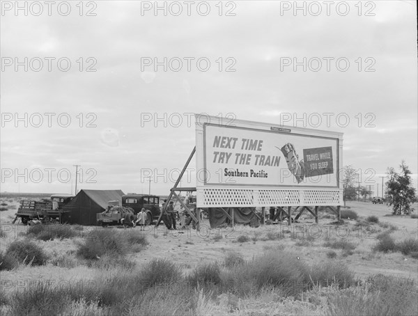 Camped in the rain behind billboard...on U.S. 99, near Famosa, Kern County, California, 1939. Creator: Dorothea Lange.