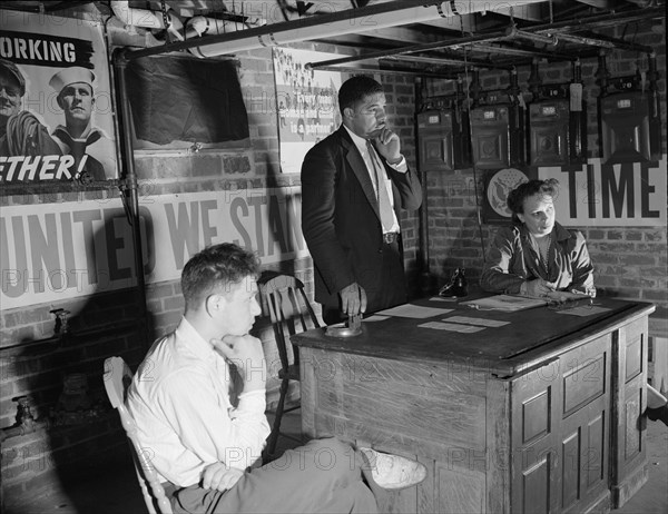 Air raid wardens' meeting in zone nine, Southwest area, Washington, D.C, 1942. Creator: Gordon Parks.