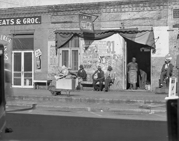 Sidewalk scene in Selma, Alabama, 1935. Creator: Walker Evans.