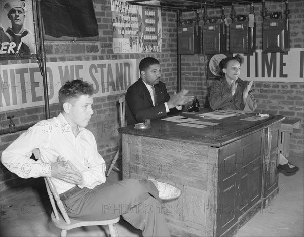 Air raid wardens' meeting in zone nine, Southwest area, Washington, D.C, 1942. Creator: Gordon Parks.