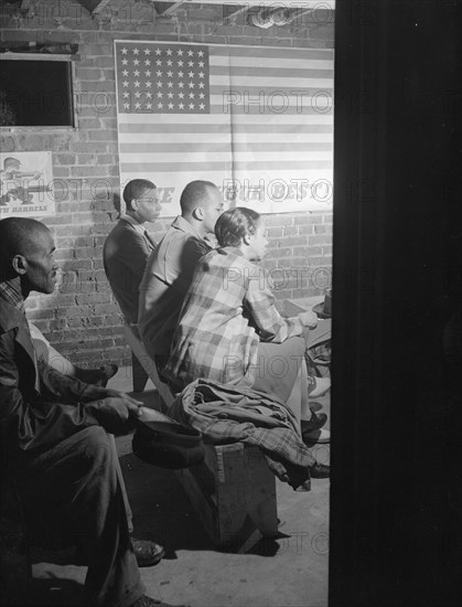 Possibly: Air raid wardens' meeting in zone nine, Southwest area, Washington, D.C., 1942. Creator: Gordon Parks.