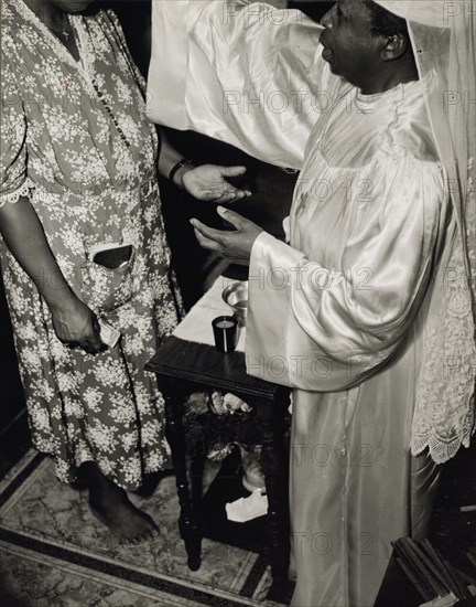 Contributions are made by all who receive the blessing and annointment..., Washington, D.C., 1942. Creator: Gordon Parks.