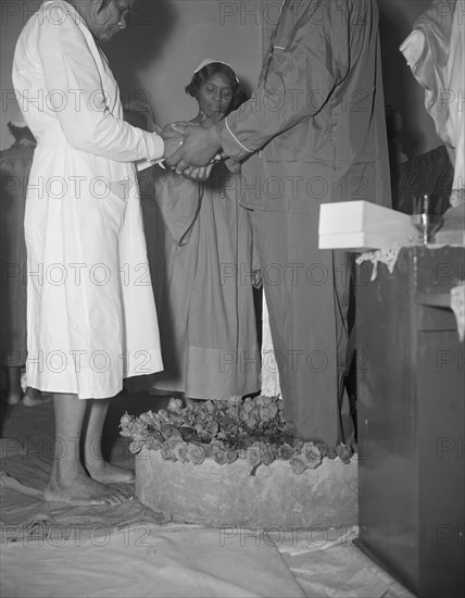 Reverend Vondell Gassaway, pastor of the St. Martin's Spiritual Church..., Washington, D.C., 1942. Creator: Gordon Parks.