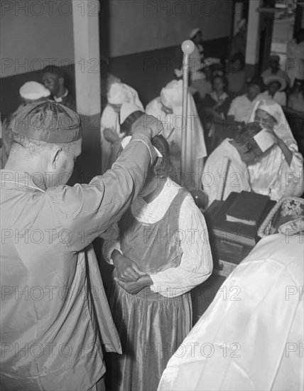 Reverend Vondell Gassway, pastor of the St. Martin's Spiritual Church..., Washington, D.C., 1942. Creator: Gordon Parks.