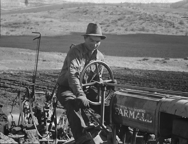 Young Idaho farmer plowing...Ola self-help sawmill co-op..., Gem County, Idaho, 1939. Creator: Dorothea Lange.