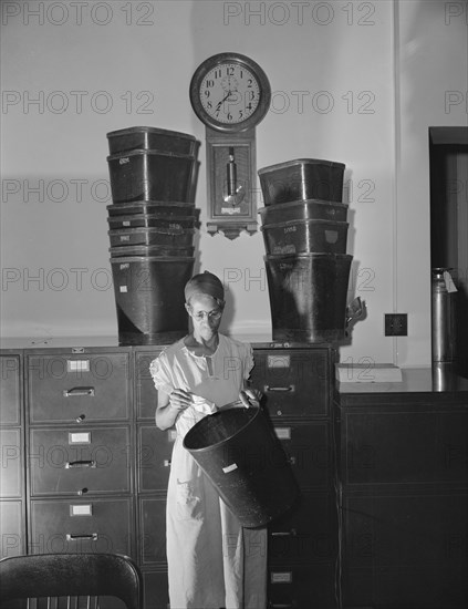 Government charwoman who provides for a family of six on her salary..., Washington, D.C., 1942. Creator: Gordon Parks.