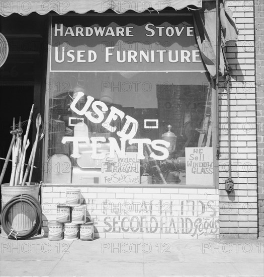 Storefront of San Joaquin Valley town, Fresno, on U.S. 99, California, 1939. Creator: Dorothea Lange.
