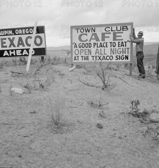 New sign along highway advertises a new enterprise in... Town of Maupin, Oregon, 1939. Creator: Dorothea Lange.