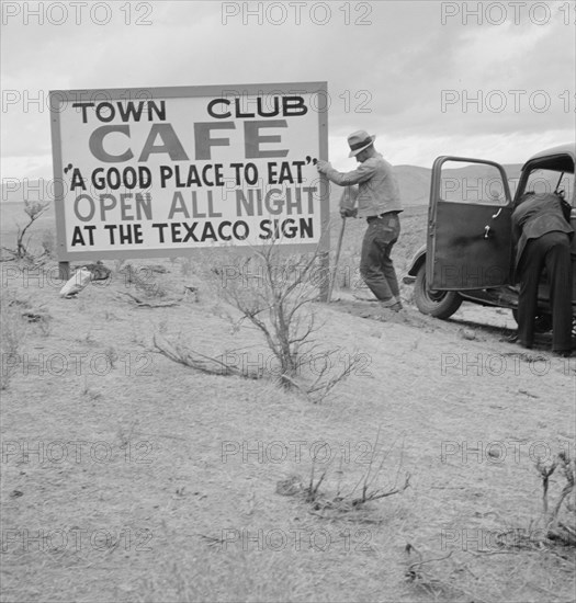New sign along highway advertises a new enterprise in... Town of Maupin, Oregon, 1939. Creator: Dorothea Lange.
