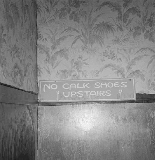 Sign on staircase on Brooks Hotel in a town..., West Carlton, Yamhill County, Oregon, 1939. Creator: Dorothea Lange.