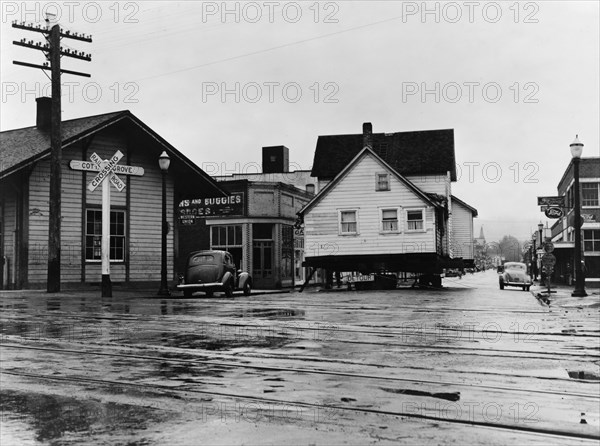 House being moved through the main street of town..., Cottage Grove, Lane County, Oregon, 1939. Creator: Dorothea Lange.