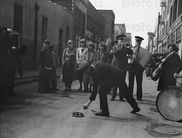 Army contributes first to the tambourine..., Salvation Army, San Francisco, California, 1939. Creator: Dorothea Lange.