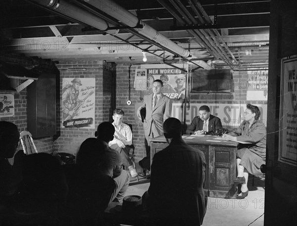 Air raid wardens' meeting in zone nine, Southwest area, Washington, D.C, 1942. Creator: Gordon Parks.