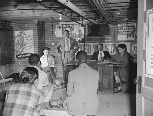 Air raid wardens' meeting in zone nine, Southwest area, Washington, D.C, 1942. Creator: Gordon Parks.