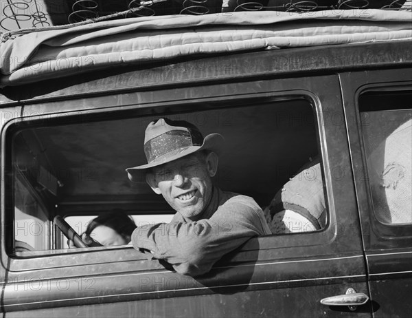 Farmer from Independence, Kansas, on the road at cotton chipping time, U.S. 99, California, 1939. Creator: Dorothea Lange.