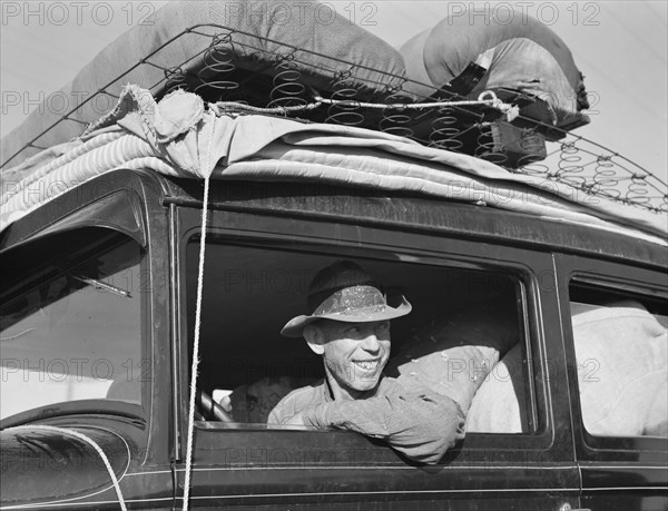 Farmer from Independence, Kansas, on the road at cotton chipping time, U.S. 99, California, 1939. Creator: Dorothea Lange.