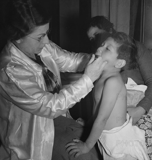 Visiting public health doctor conducts well-baby clinic..., Calipatria, Imperial Valley, 1939. Creator: Dorothea Lange.