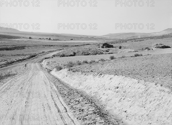 Entering Cow Hollow region in which practically all are FSA borrowers, Malheur County, Oregon, 1939. Creator: Dorothea Lange.