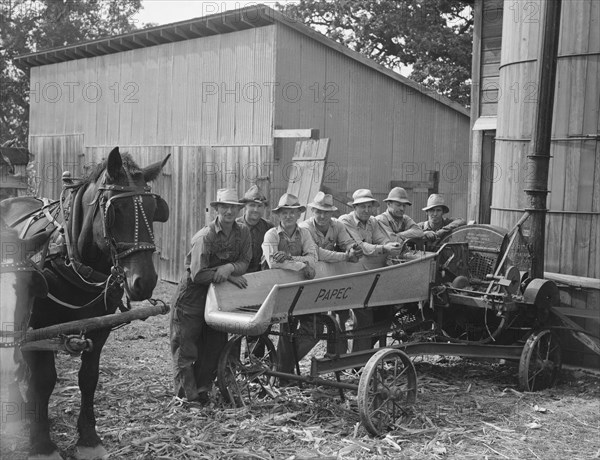 Seven of the eight farmers shown with their cooperatively owned...Yamhill County, Oregon, 1939. Creator: Dorothea Lange.