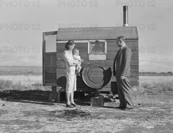The doctor reassures the mother after having seen the sick..., Merrill, Klamath County, Oregon, 1939 Creator: Dorothea Lange.