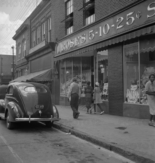 The main street, Fayetteville Street, of Siler City, North Carolina, 1939. Creator: Dorothea Lange.