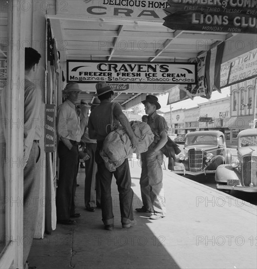 Main street, in front of Oregon Employment Center office, Independence, Polk County, Oregon, 1939. Creator: Dorothea Lange.