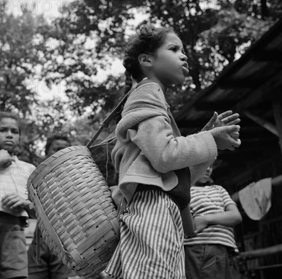 Michailyn calling her buddie Marie at Camp Fern Rock, Bear Mountain, New York, 1943 Creator: Gordon Parks.