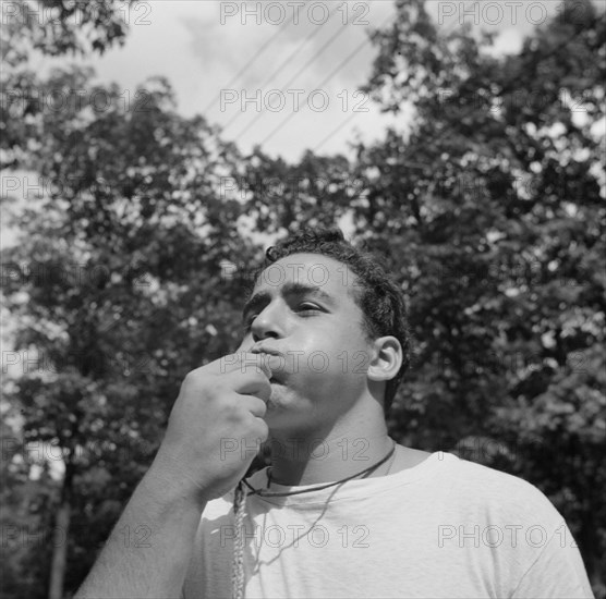 The town crier, Danny Poocchiari., Camp Nathan Hale, Southfields, New York, 1943 Creator: Gordon Parks.